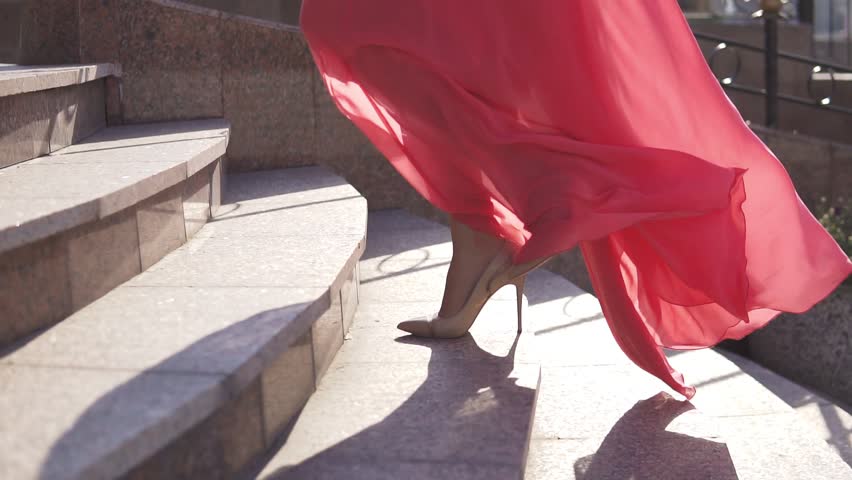 closeup of female legs in high heels. the girl climbs the stairs
