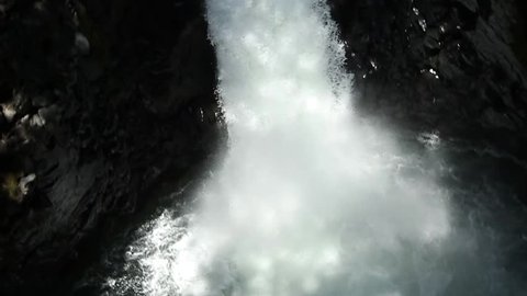 Duende waterfall jump in kayak in Ecuadorian rain forest. HD slow motion.