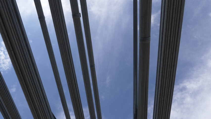 The many cables that come together to form one big cable as a primary support for a suspension brings. Royal Gorge over the Arkansas River, the highest suspension bridge in the US. 4K UHD.