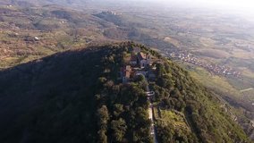 Aerial shot of beautiful little italian town on the hill with a nice church, 4K
