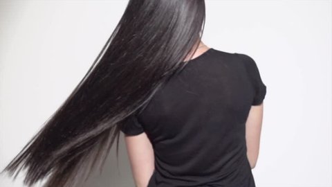 Beautiful long Hair. Beauty woman with luxurious straight black hair. Sexy brunette Model girl with Healthy Hair. Lady with long smooth shiny straight hair. Hairstyle, cure, extensions. 4K slow motion