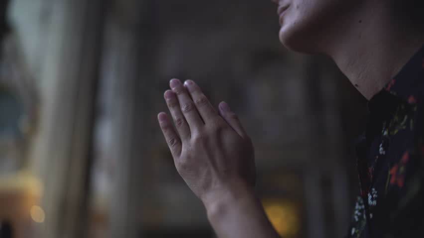 Woman praying in church. Close up, UHD 4K | Shutterstock HD Video #29345242