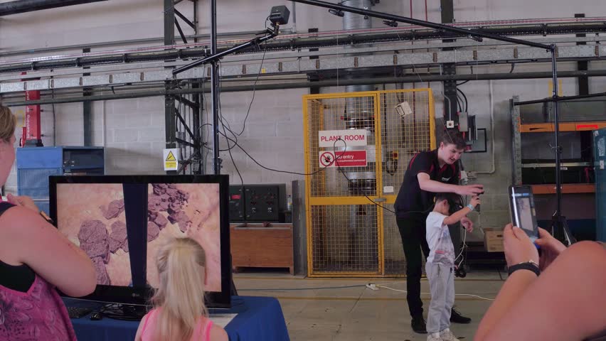 RNAS YEOVIL, United Kingdom - 8th July 2017. Virtual reality game. boy parachutes using head-mounted display in VR. | Shutterstock HD Video #29345932