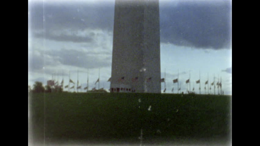 Washington Monument. Flags at half-staff. 8mm film footage. Filmed on super8 film tape, with Super8 camera.
