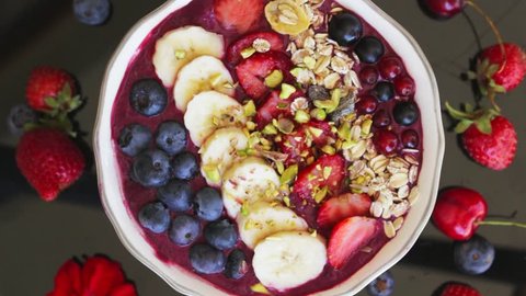 rotating acai berry bowl with fruits, close