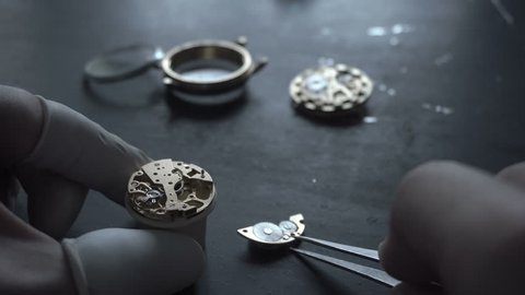 Watch maker is repairing a vintage mechanical watches