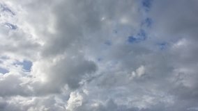time-lapse video of beauty sky with white clouds on day time before rain clouds. 