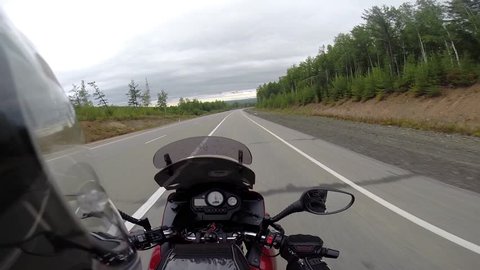 motorcyclist driving on road