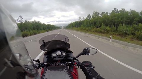 motorcyclist driving on road