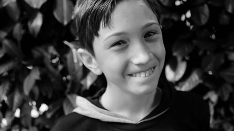 little boy smiling - black and white