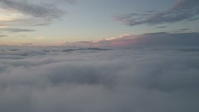 Time lapse of moving large clouds or mist during morning.