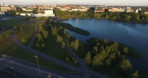 4K aerial view drone footage of Helsinki railway tracks, sea lagoon and area near main railway station, panorama in the capital of Finland, northern Europe on quiet windless sunny summer morning