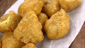 Fresh made Hot Cheese Nuggets (with Chilis) as not loopable 4K UHD footage