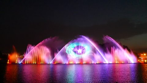 VINNYTSA, UKRAINE-AUGUST 1, 2016: Grand Large floating musical colorful dancing fountain, great festive laser light show at holiday celebration feast. Color glare and reflections of a night city