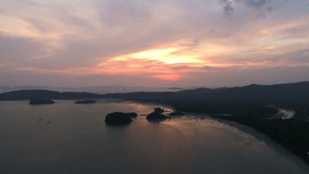 Aerial View: Flying over Ao Nang or Krabi coastline at sunset. 4K Video