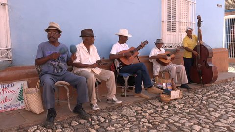 TRINIDAD, CUBA - FEBRUARY 2017: Classic Cuban band plays traditional music on the cobbled streets of historic Trinidad town