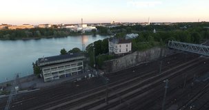 4K aerial view drone footage of Helsinki railway tracks, sea lagoon and area near main railway station, panorama in the capital of Finland, northern Europe on quiet windless sunny summer morning
