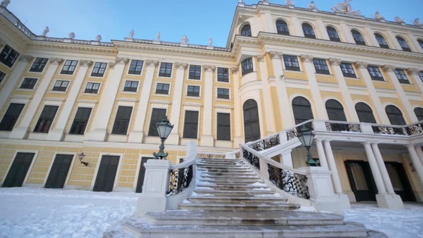 Entrance with stairway of Schonbrunn Palace, panoramic motion at winter day in Vienna, Austria