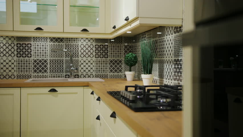 Close up view of fashion black and white wooden kitchen in the traditional classic style. View from the side.