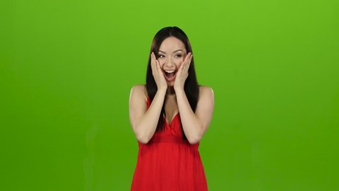 Girl received a big win, she is happy with her victory. Green screen