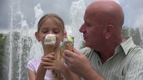 Child Eating Ice Cream with Father in Park, Family Relaxing Outdoor, Fountain 4K