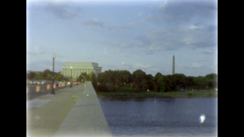 Arlington Bridge and Lincoln Memorial. Boat on Potomac river. 8mm film footage. Filmed on super8 film tape with Super8 camera.