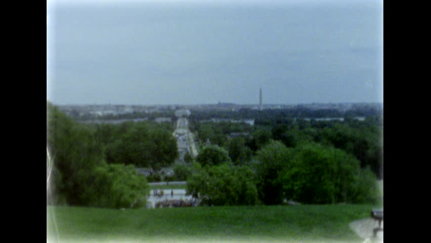 Washington DC. Arlington Bridge, Lincoln Memorial and Washington Monument. View from the distant hill of Arlington National Cemetery. 8mm film footage. Filmed on super8 film tape, with Super8 camera.