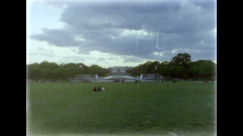 Lincoln Memorial, reflecting pool and WW II Memorial seen from a distance. 8mm film footage. Filmed on super8 film tape with Super8 camera.