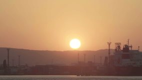 Sunset at seapost Timelapse. Sunset landscape. Transportation and logistic background. Cargo ships and cranes in seaport on sunset video
