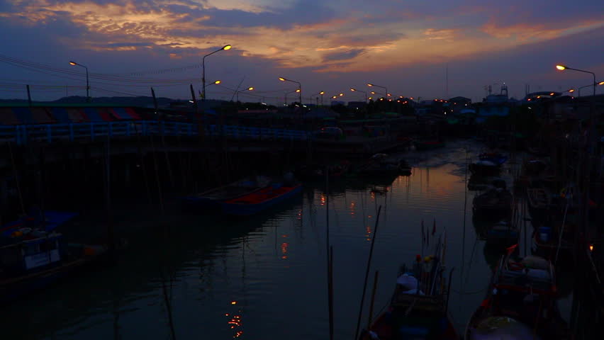Time lapse of sky at fisherman village in the morning, Thailand. Low key toned image.