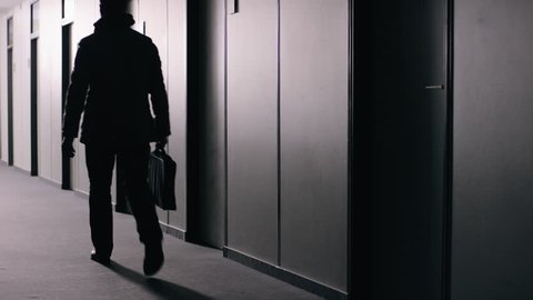 Office employee walking down corridor