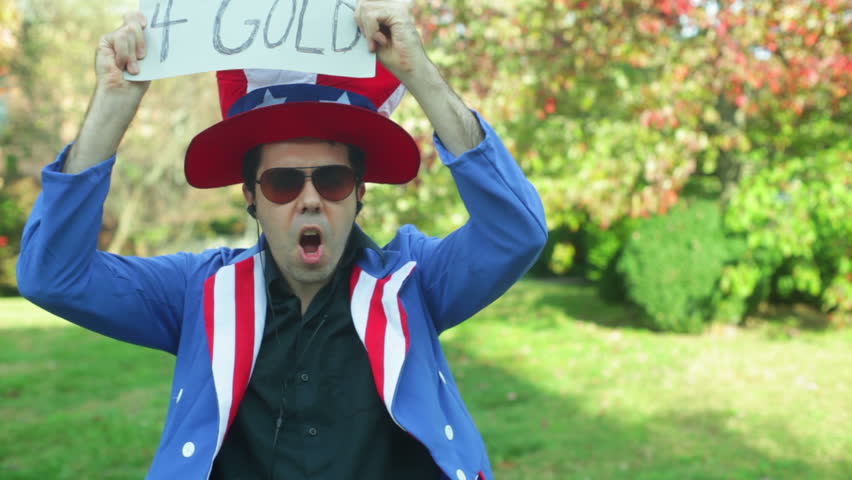 Gold exchange guy with a sign