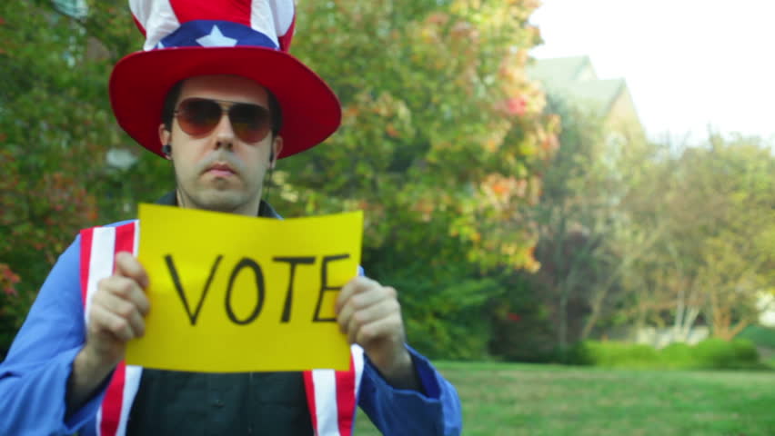 uncle sam costume guy, with a vote sign