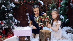 Granddaughters pack a white shawl as a present to their beloved grandmother in a gift box. - Powered by Shutterstock - Get 15% off with code: PIKWIZARD15