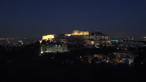 4K Illuminated Acropolis ancient temple in Athens, city destination by night 