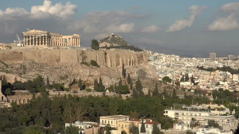 4K Pan left of Acropolis temple in Athens metropolis, cityscape panoramic day view