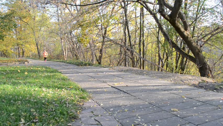 little girl running along the path to meet her mother