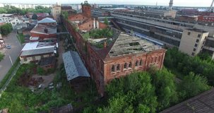 4K aerial view drone video of Orekhovo-Zuevo railway tracks, abandoned dilapidated old factory buildings, area near main railway station in small town 100 km east of Moscow, Russia on summer morning