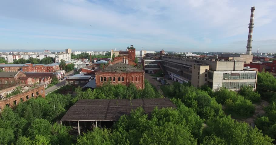 4K aerial view drone video of Orekhovo-Zuevo railway tracks, abandoned dilapidated old factory buildings, area near main railway station in small town 100 km east of Moscow, Russia on summer morning | Shutterstock HD Video #29437912