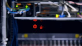 Network activity lights blink in red and green inside a data center cabinet. 4K. - Powered by Shutterstock - Get 15% off with code: PIKWIZARD15