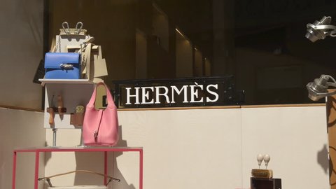 Milan, Italy - June 22, 2017: Shop window of a Hermes shop in Milan – Montenapoleone area. Milan in summer becomes a popular shopping destination for tourists. Fall Winter 2017 Collection.