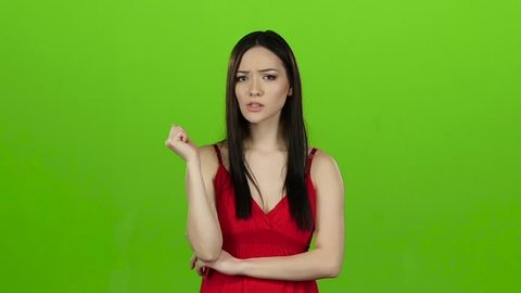 Girl is looking for answers to questions and finds a solution. Green screen. Slow motion