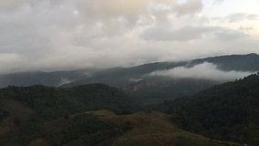 In the northern of Thailand, Clouds and mist are moving on the high mountains with strong winds after heavy rain . It make cold and feel refreshing, freedom,  happy. Looks like we can fly in the air.