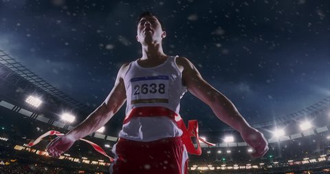 Male track and field runner crosses finishing line on the professional sports arena. The man is happy, smiling with his arms raised. Arena and people on it are made in 3D and animated.