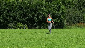 Fitness Running Women. Athletic woman working out in a meadow 