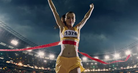 Track and field female  runner crosses finishing line on the professional sports arena. The man is happy, smiling with his arms raised. Arena and people on it are made in 3D and animated.
