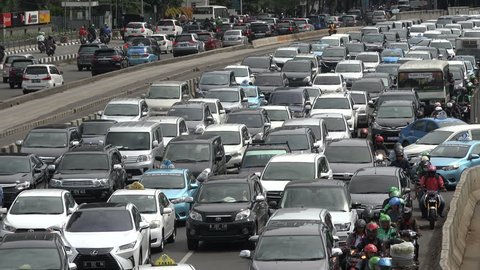 JAKARTA, INDONESIA - APRIL 2017: Commuters are stuck in slow moving traffic in Jakarta, Indonesia