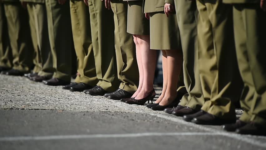 Detail with soldiers in uniforms standing in formation during military ceremony