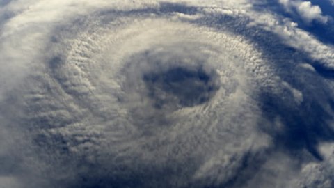 Hurricane seen from space, flying into storm