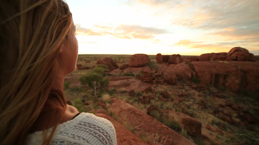 Young woman makes heart shape finger frame to spectacular landscape-sunrise
Young woman at the devil's Marbles makes a heart shape finger frame to the spectacular landscape at sunrise. Royalty-Free Stock Footage #29489053